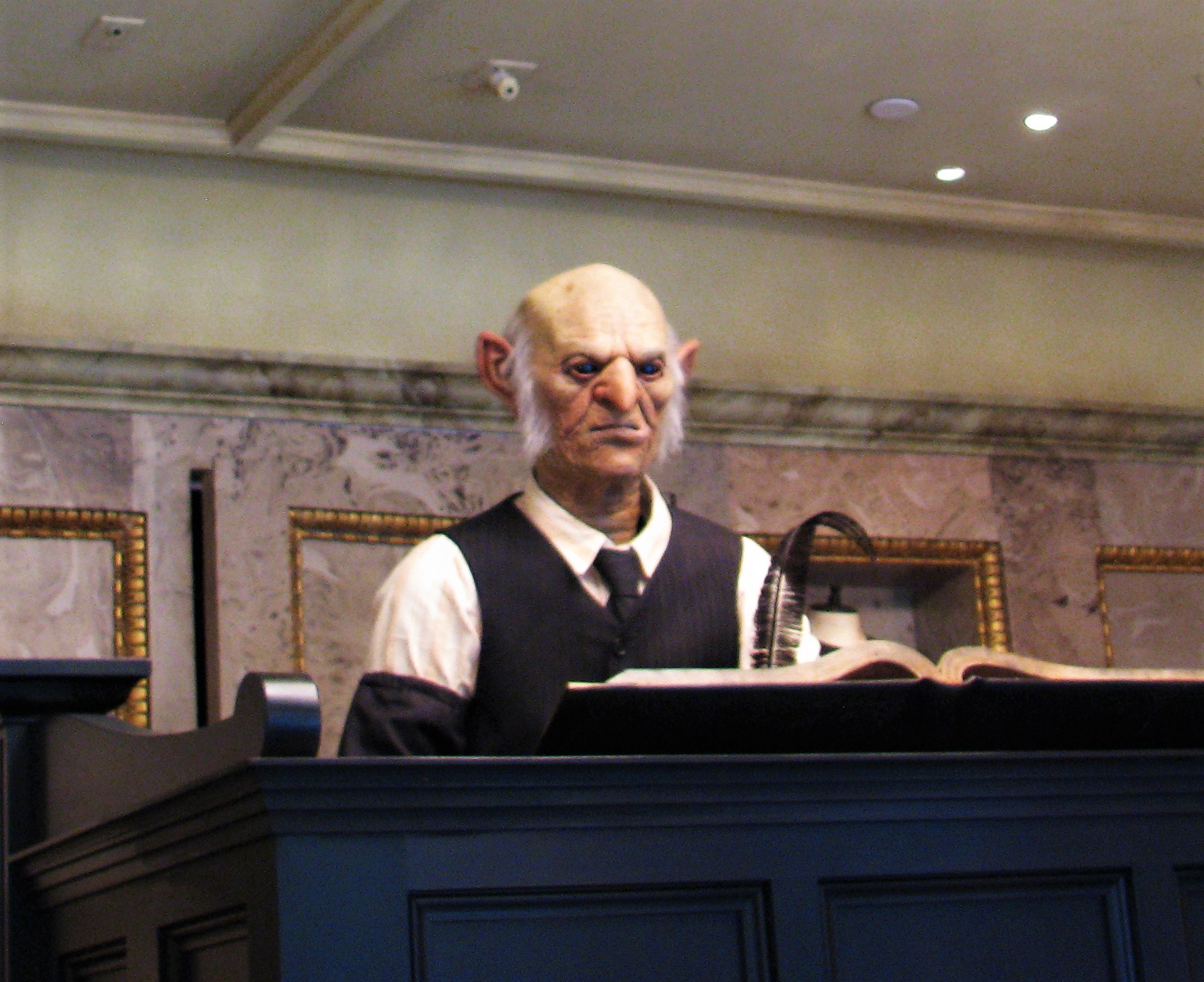 Goblins tending to their account ledgers in Gringotts Bank.