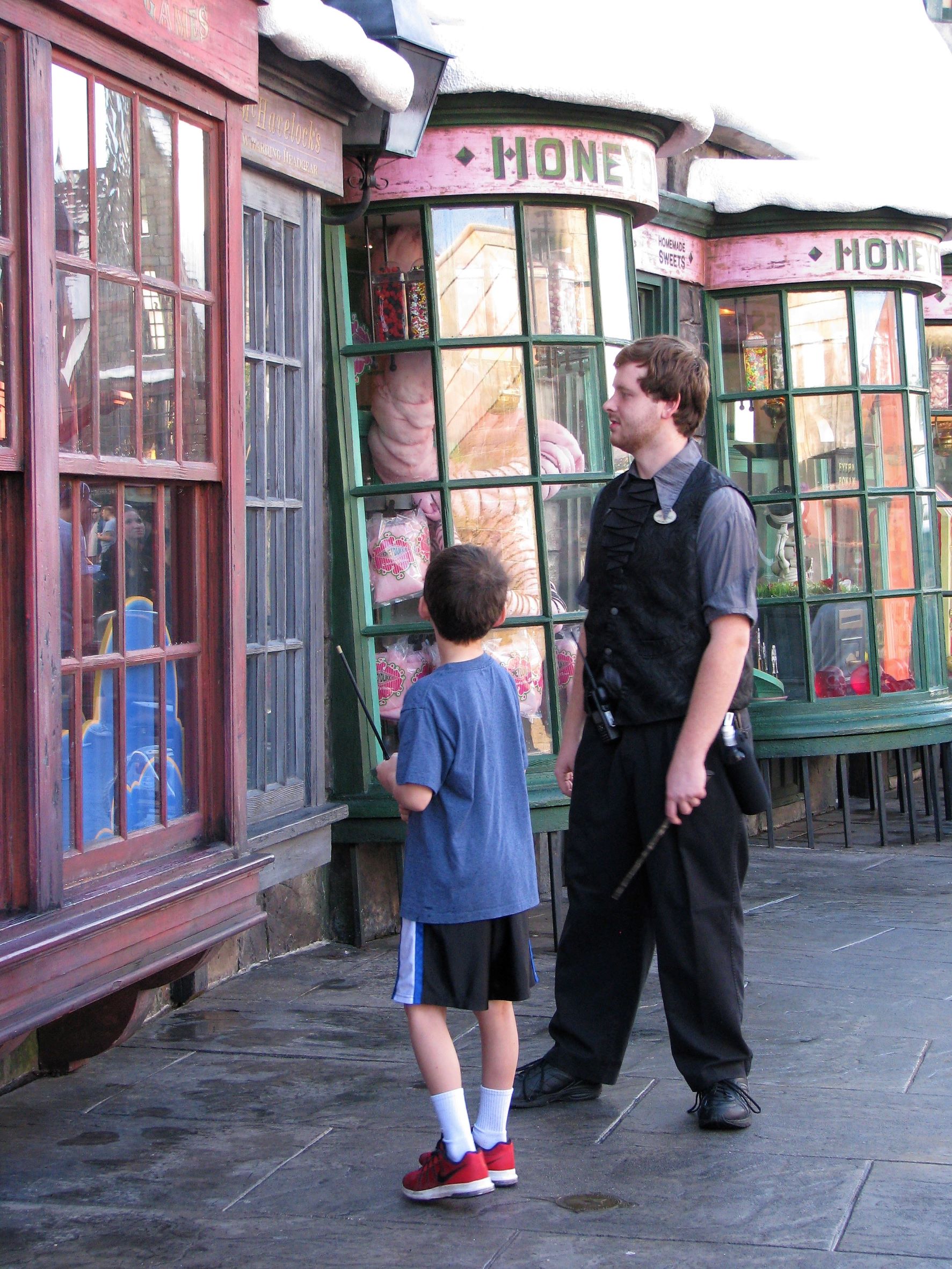 Using an interactive wand to cast a spell in The Wizarding World of Harry Potter.