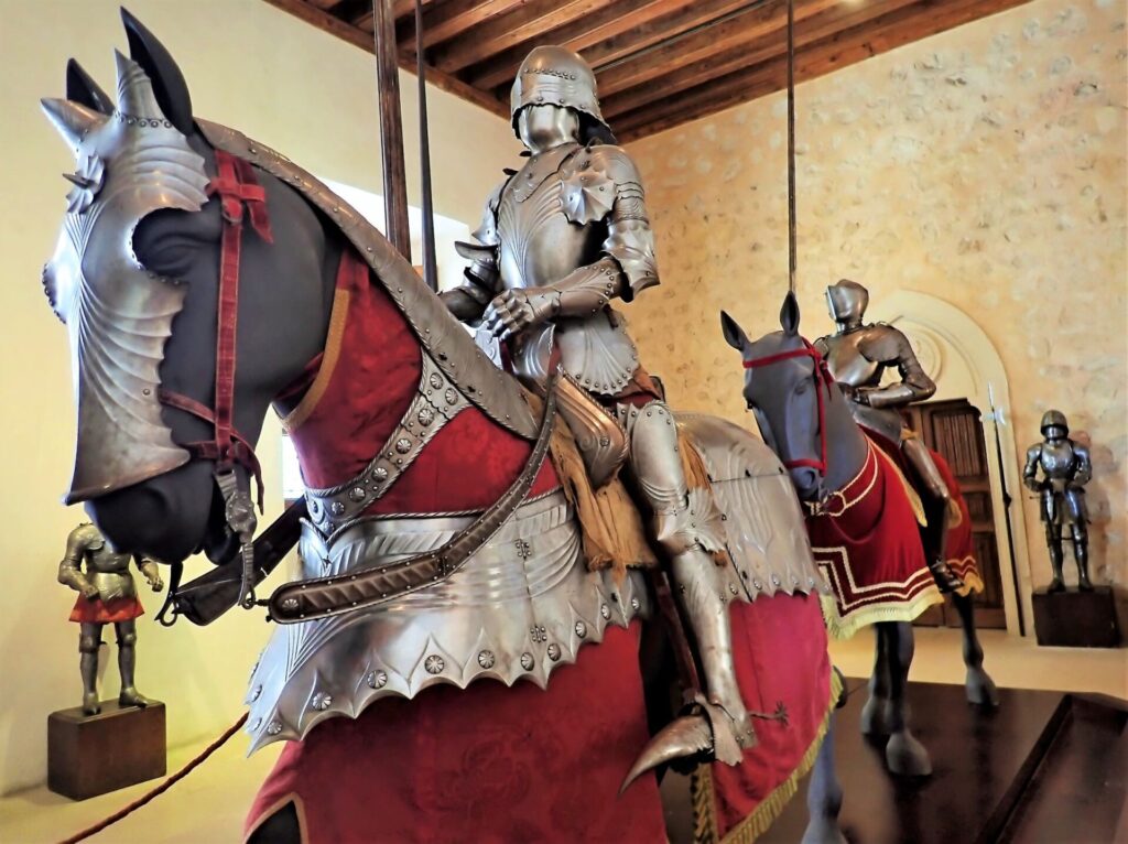 Mounted Knight in a suit of armor inside of the Alcázar Castle, located in Segovia, Spain