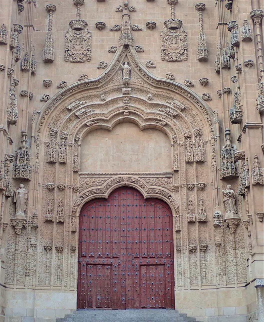 One of the ornate entrances to the New Cathedral in Salamanca, Spain