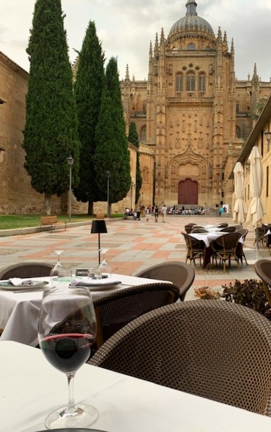 View of an entrance to Salamanca's New Cathedral from the outside tables at the El Huerto de Doña Deseada  Restaurant