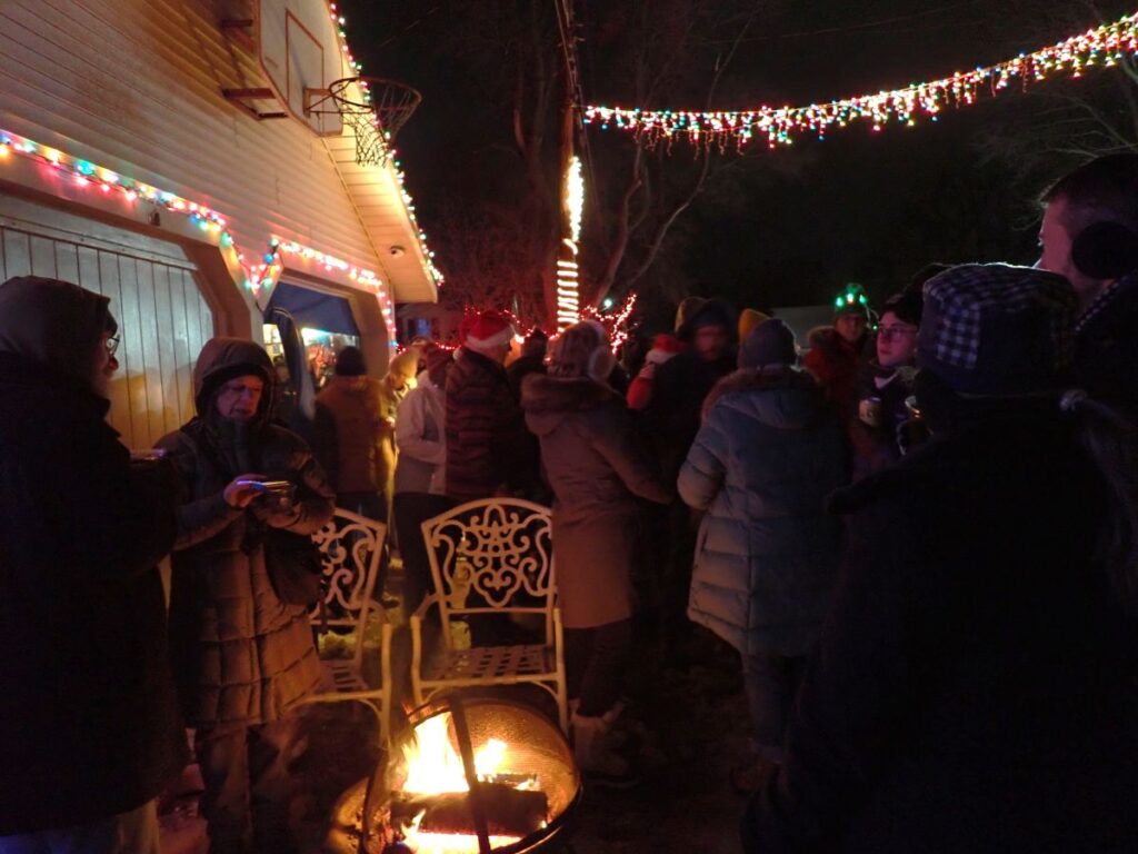 Friends and neighbors gather in Christmas Alley the Saturday before Christmas