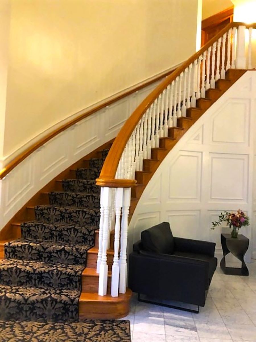 The curved staircase heading to the second floor in the Inn at Black Star Farms