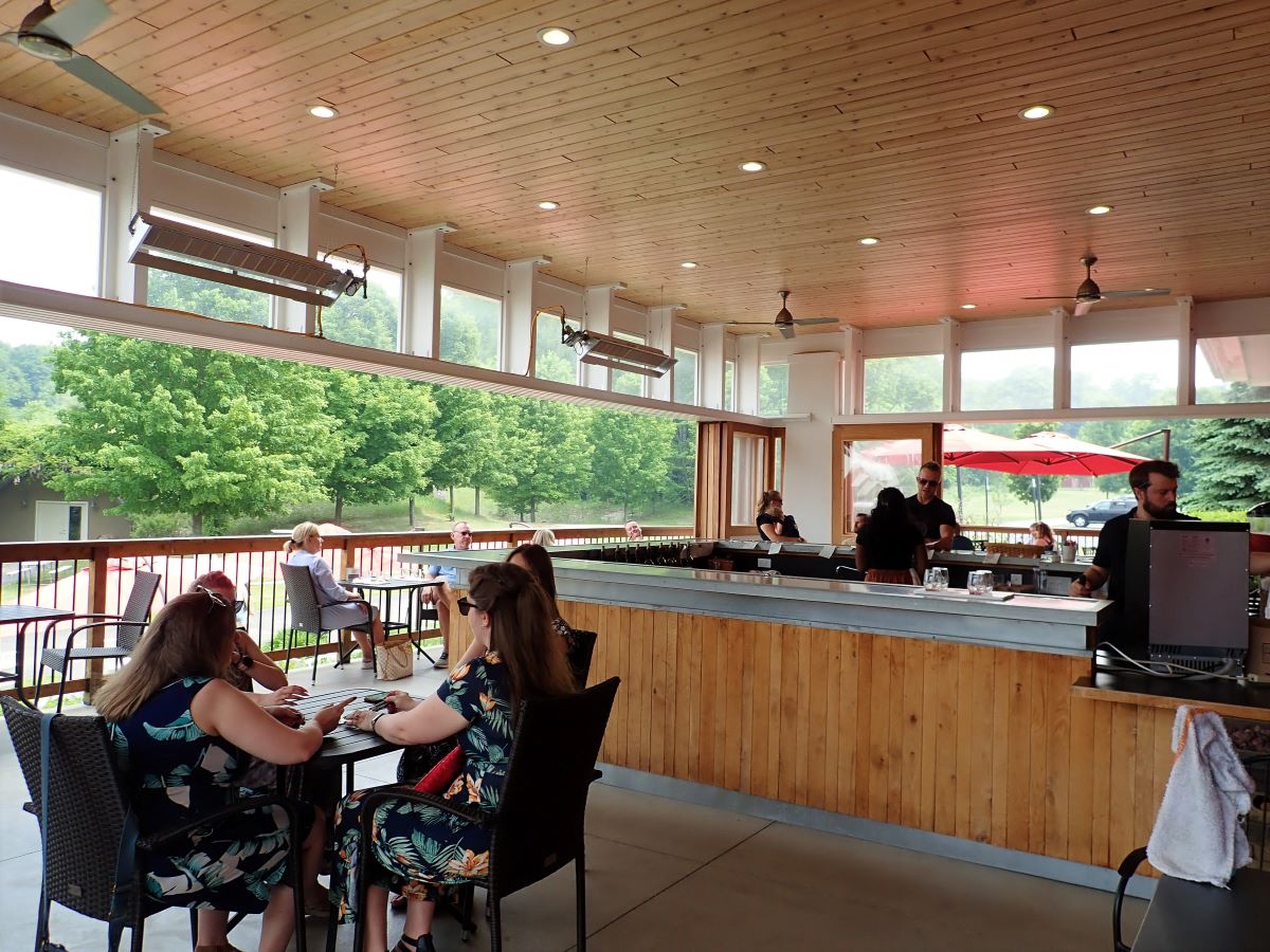 Enjoying wine tasting on the covered Terrace Patio at Black Star Farms Winery