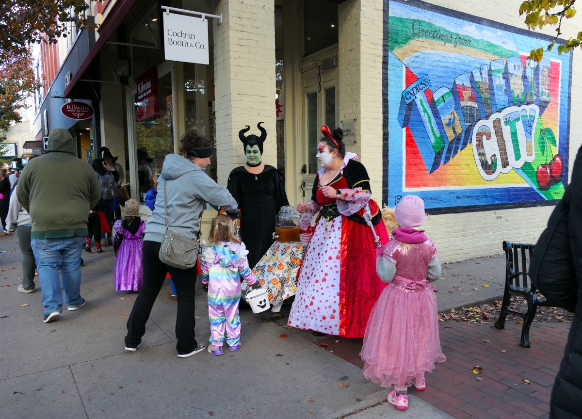 Kids dress up for trick-or-treating during Traverse City's Downtown Halloween Walk.