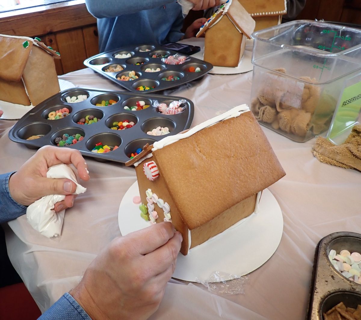 Decorating gingerbread houses at Moomers in Traverse City.