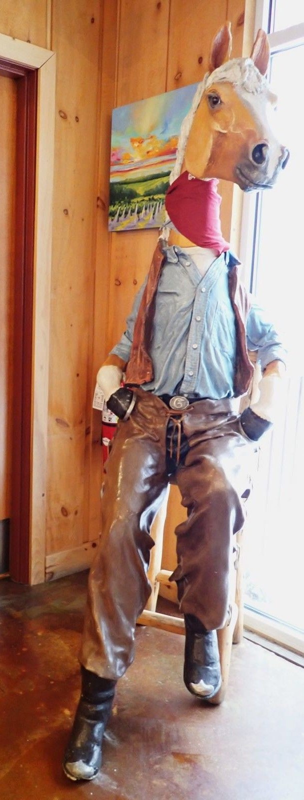 A horse dressed up as a cowboy keeps watch over the men's room at 45 North.