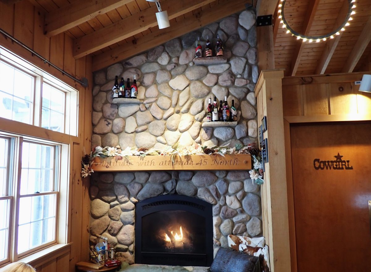 Large stone fireplace inside of 45 North Winery