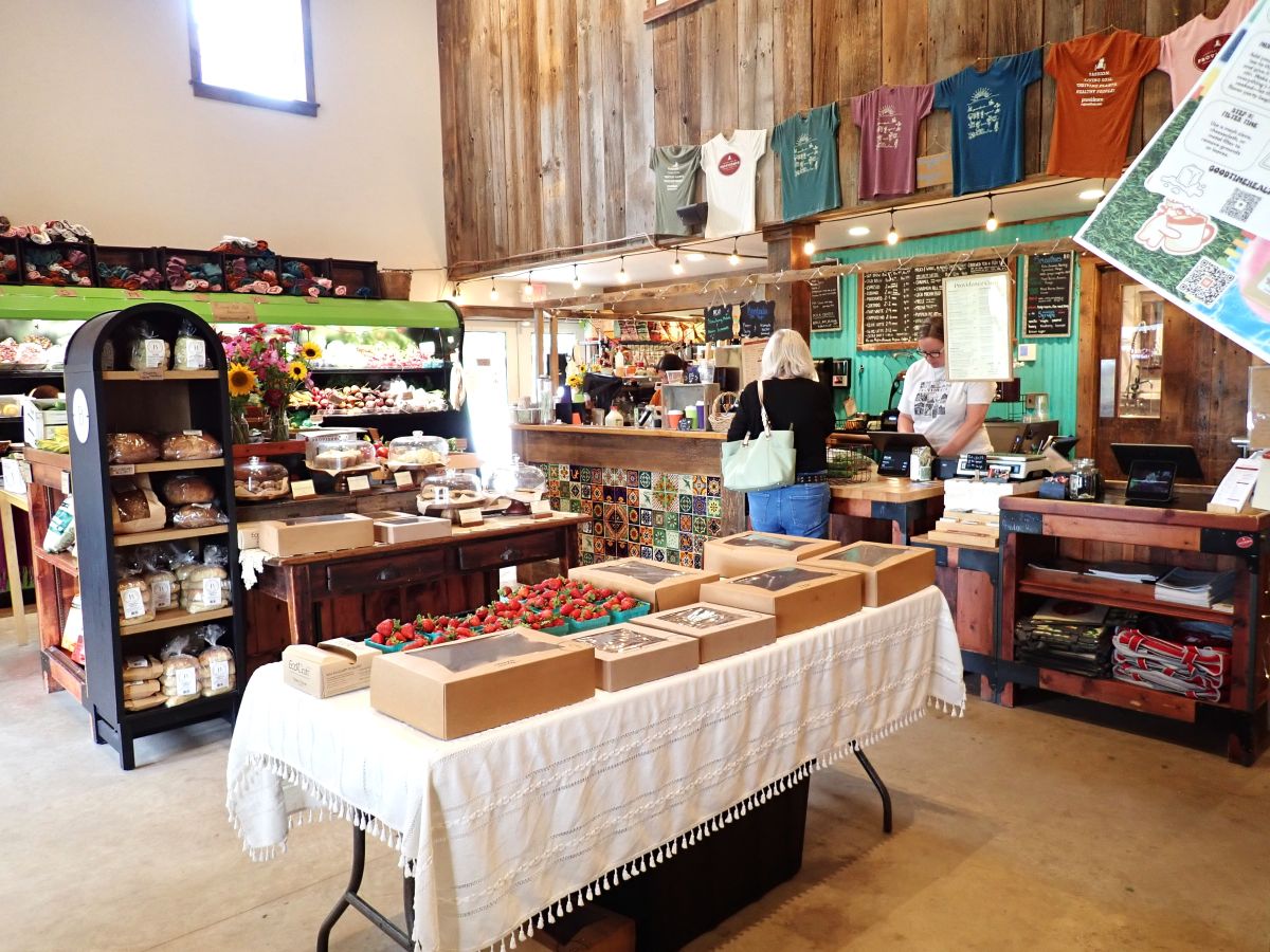 Baked goods and produce for sale inside the market at Providence Farm